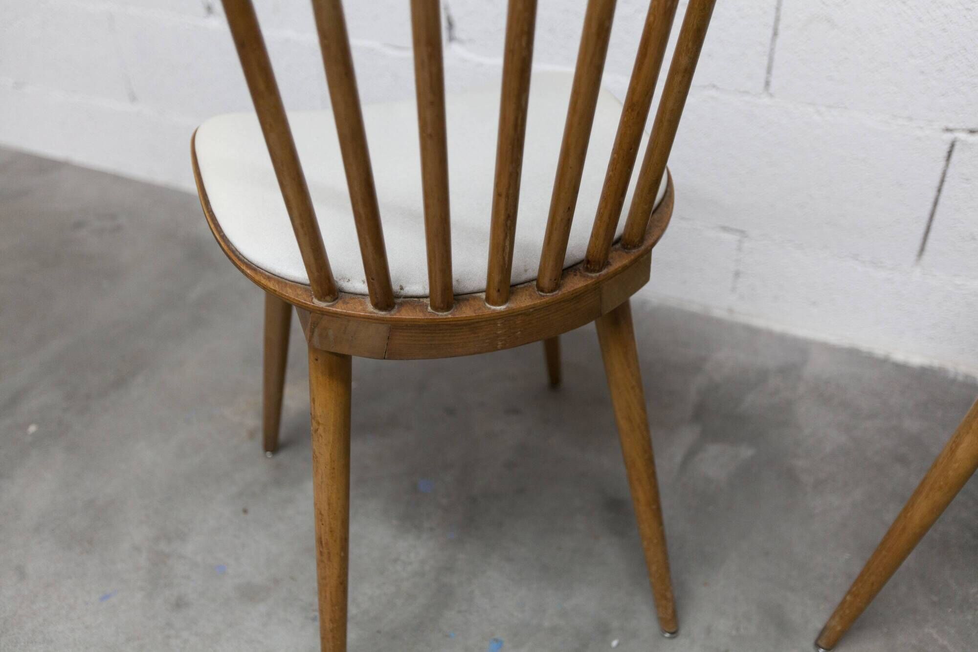 Pair of Baumann Menuet chairs, Honey patina, White skai seat