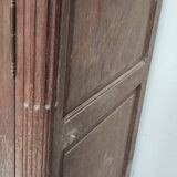 Bonnetière man standing cabinet a door