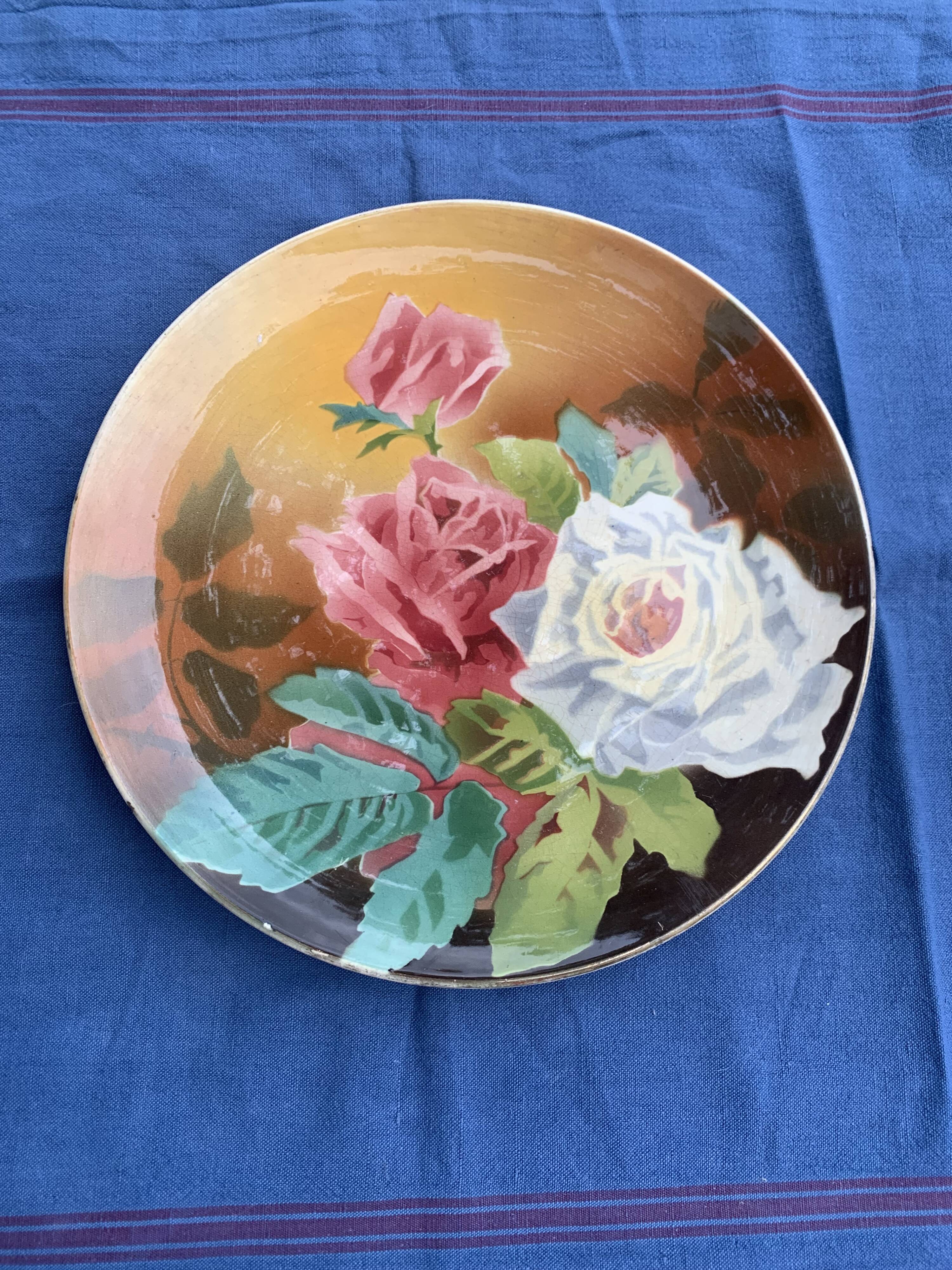 Plate with iron rose motifs, hb, Choisy le roi art deco