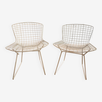 2 white Bertoia chairs
