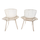 2 white Bertoia chairs