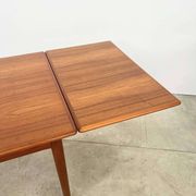 Teak dining table with integrated extensions — Scandinavian