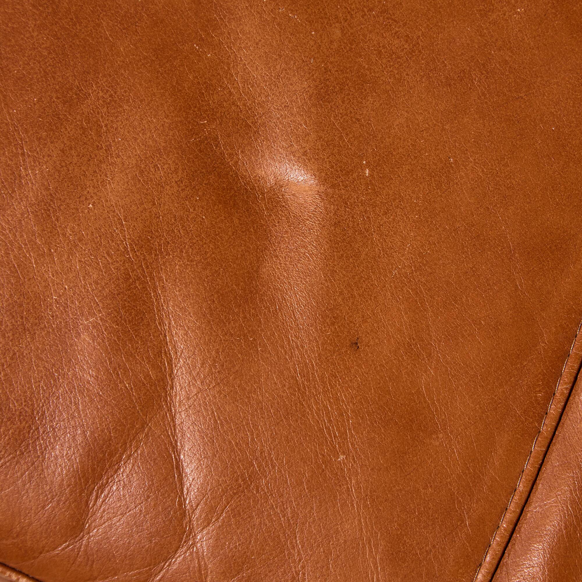 Ottoman with leather upholstery