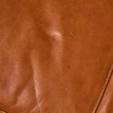 Ottoman with leather upholstery