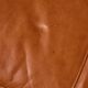 Ottoman with leather upholstery