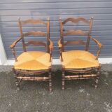 Pair of blackened wooden armchairs