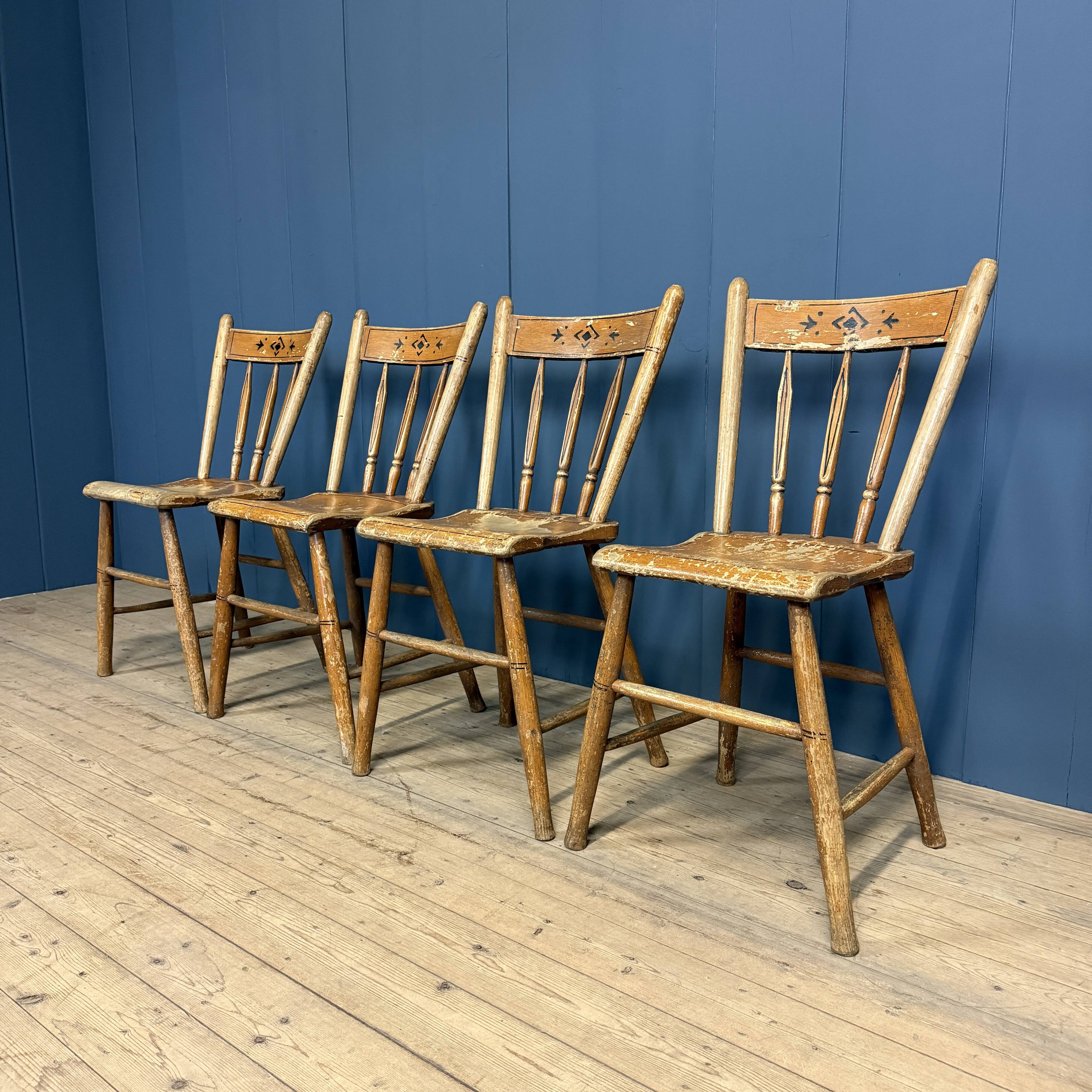 Set of four painted Dutch kitchen chairs.