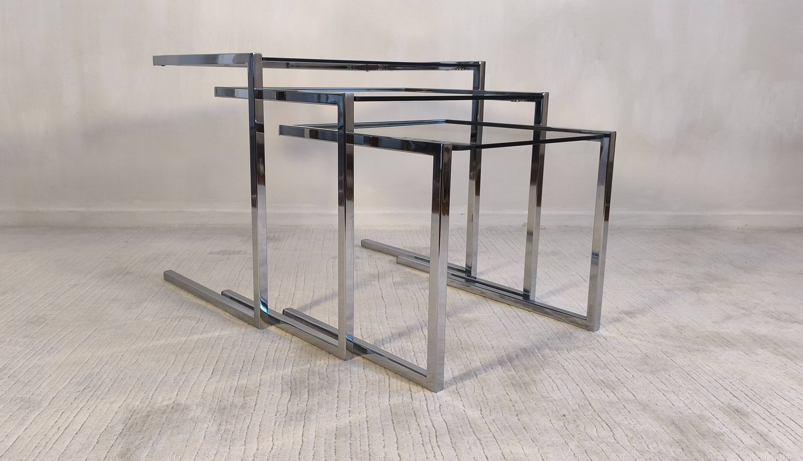 Set of 3 vintage nesting tables in chrome and smoked glass, Roche Bobois style.