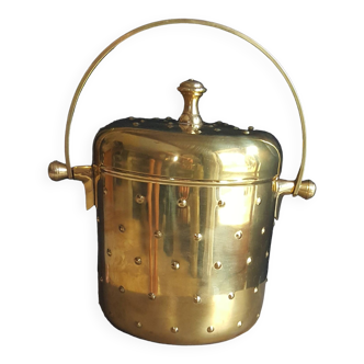 Designer ice bucket in shiny gold-colored brass