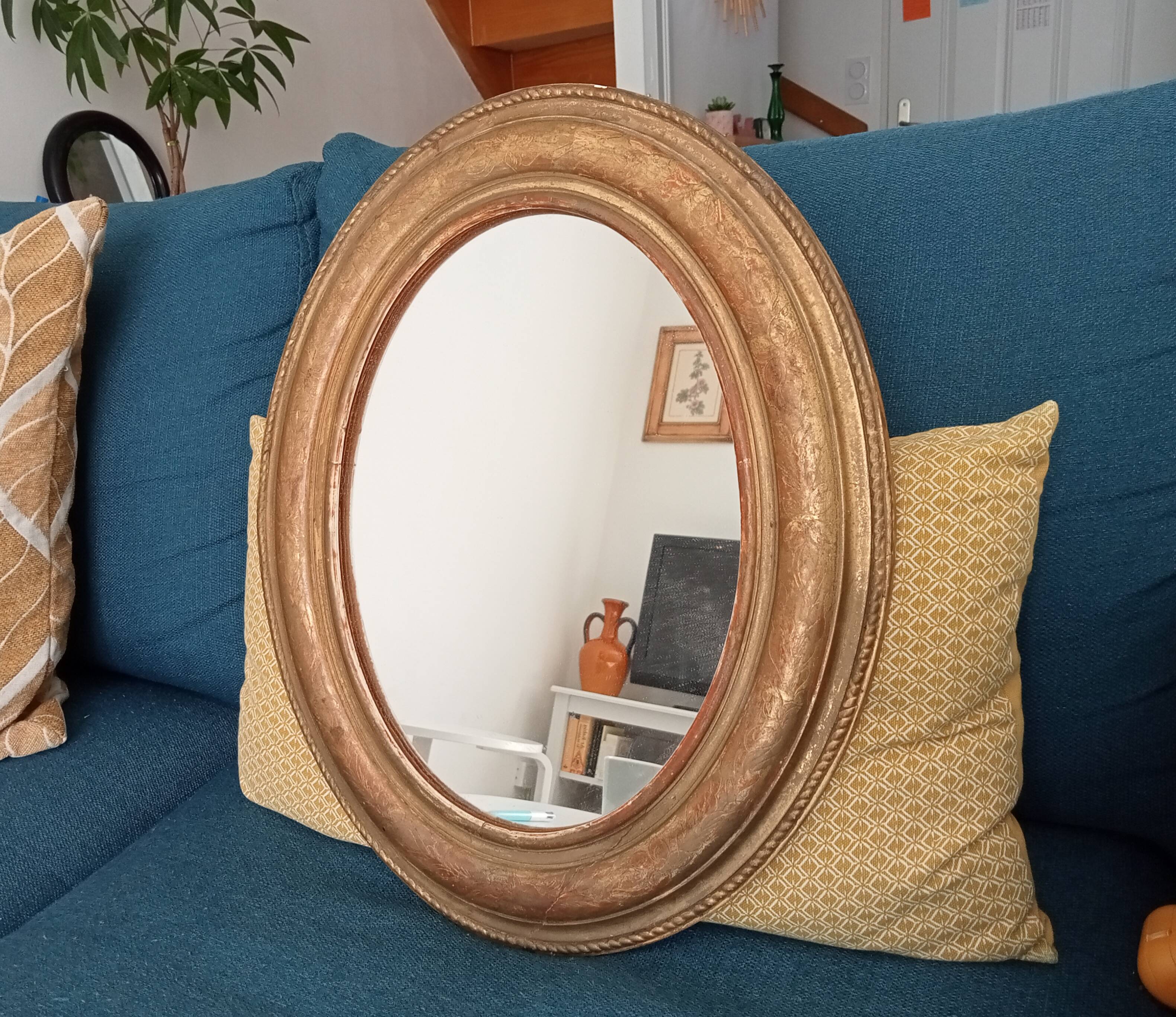 Louis Philippe 19th century oval gilded mirror in wood and stucco