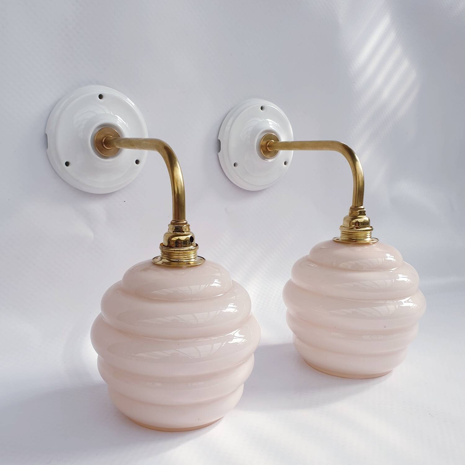 Swan neck and glass globe wall lights
