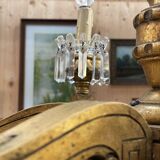 Golden wooden chandelier with crystal pendants from the 19th century.