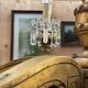 Golden wooden chandelier with crystal pendants from the 19th century.
