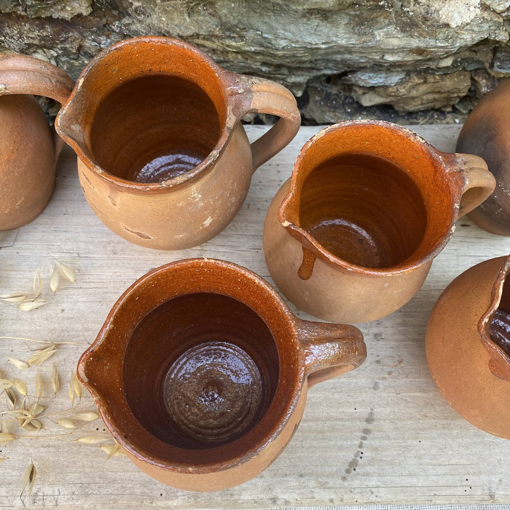 set of terracotta jugs country style