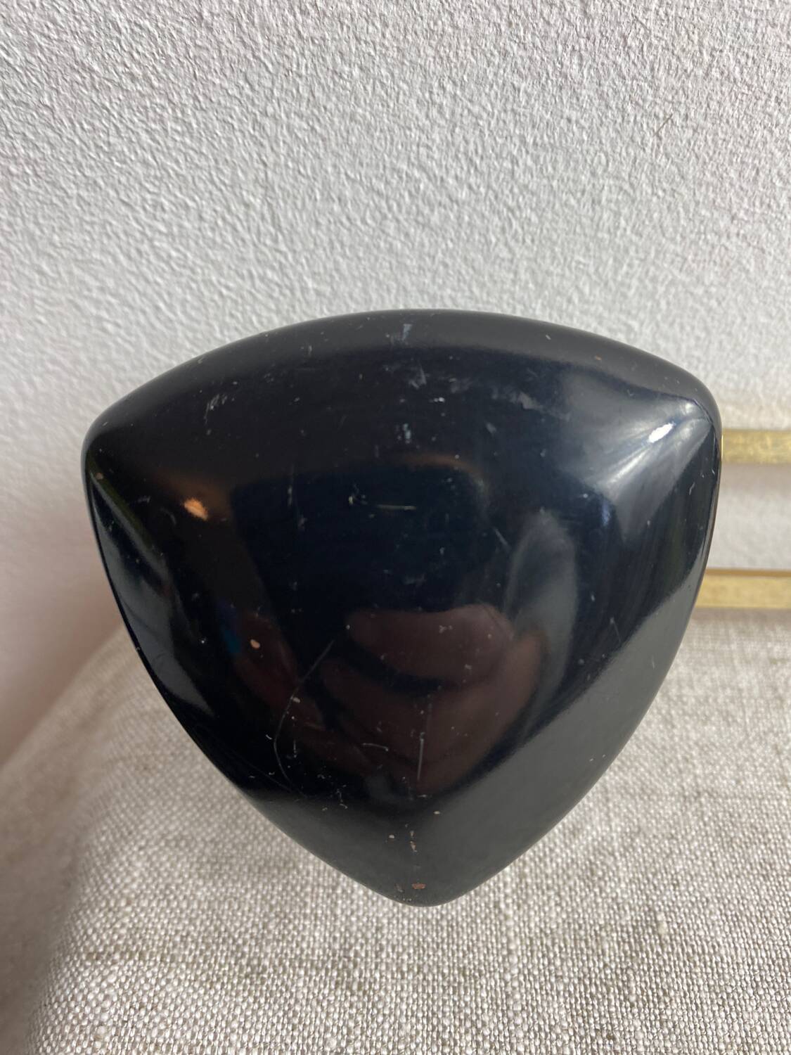 Wall-mounted coat rack with 3 hooks from the 1960s.