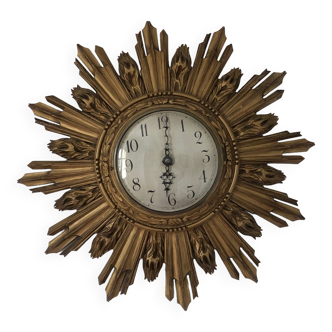 Sun clock in gilded wood 1930