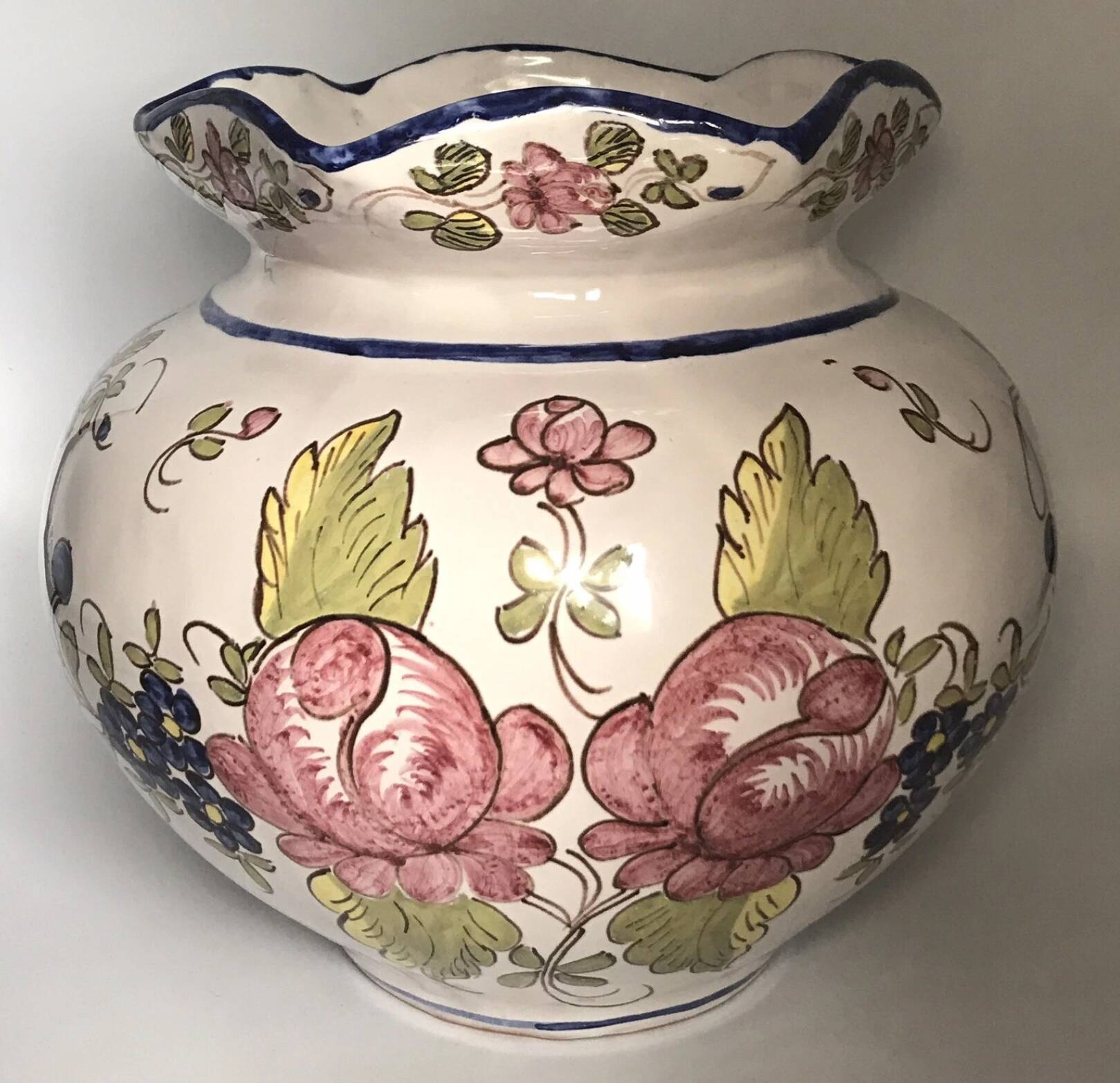 Round earthenware vase with polychrome floral motifs, signed