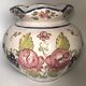 Round earthenware vase with polychrome floral motifs, signed