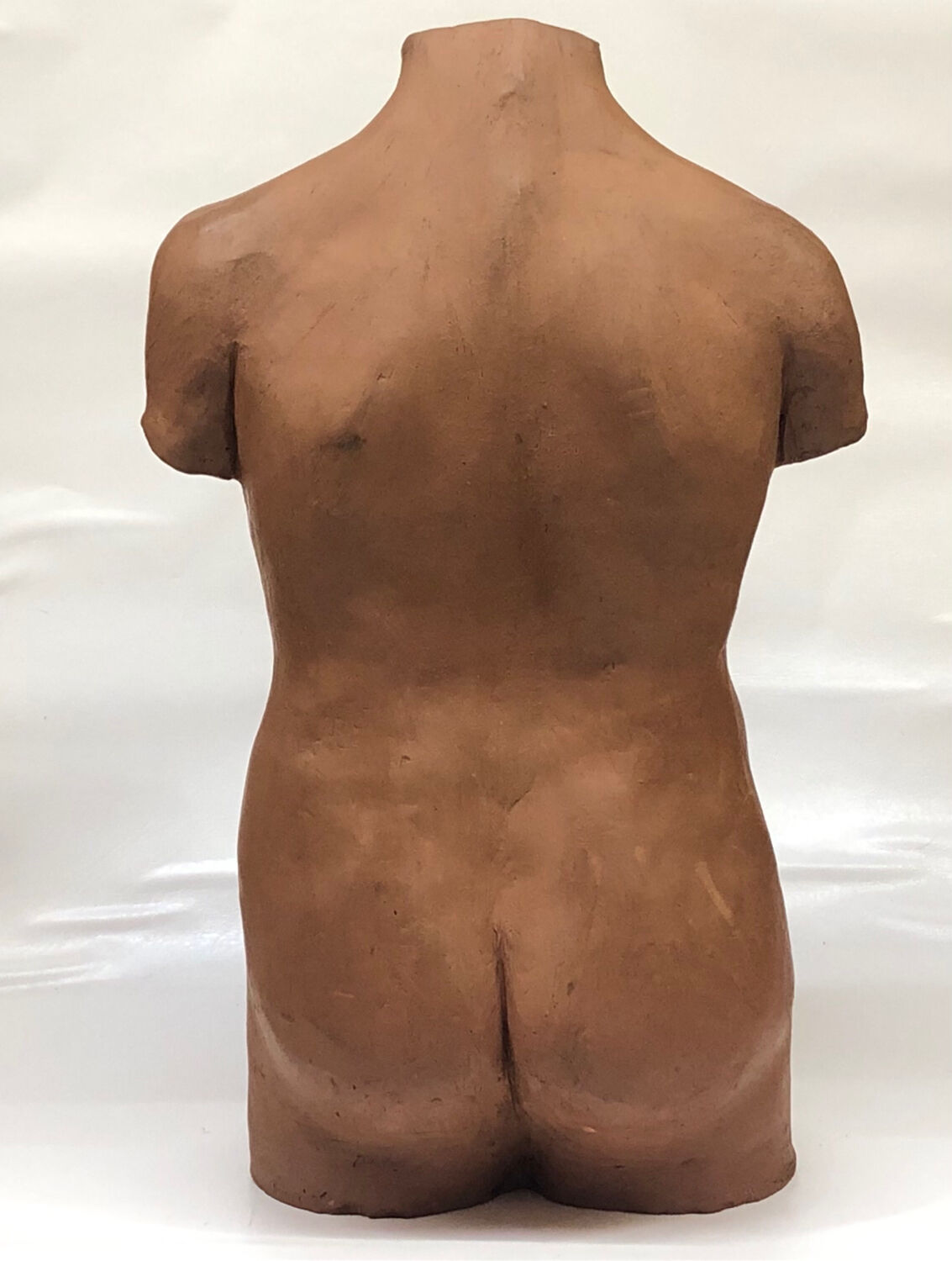 School bust of a female body in red clay terracotta