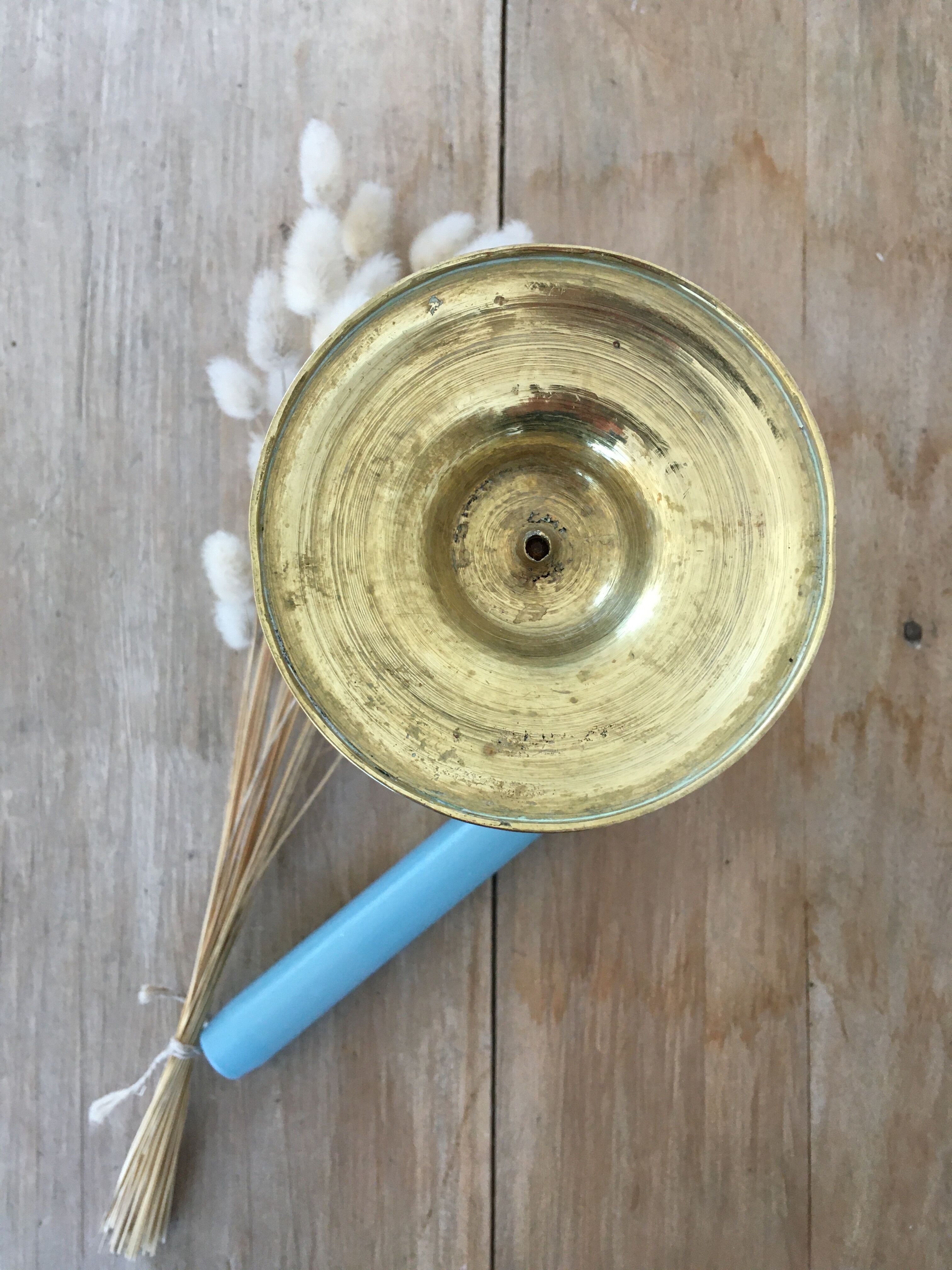 Chiseled brass candle holder