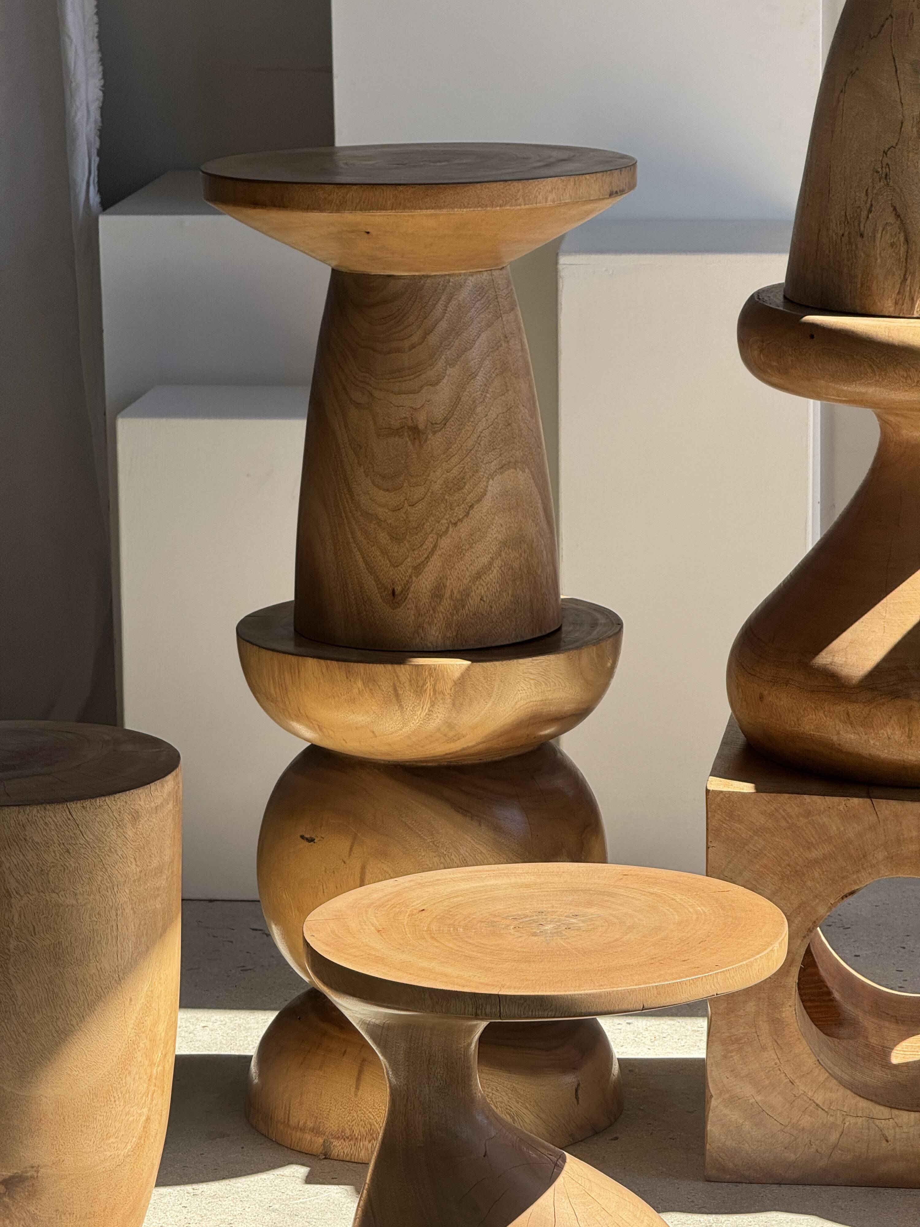 Natural solid mango side table (monoxyle) with conical legs.