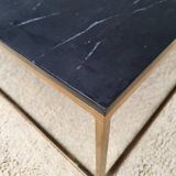 Coffee table or black marble and brass display "in its own juice"