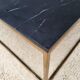 Table basse en marbre noir et laiton