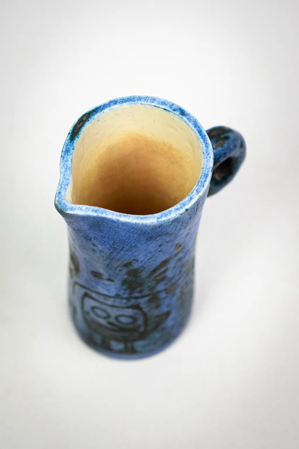 Small jug by Jacques Blin in blue ceramic with engraved animal decoration.