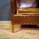 Antique club armchair of leather cloth
