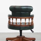 Dark green chesterfield office chair in cowhide leather on wheels