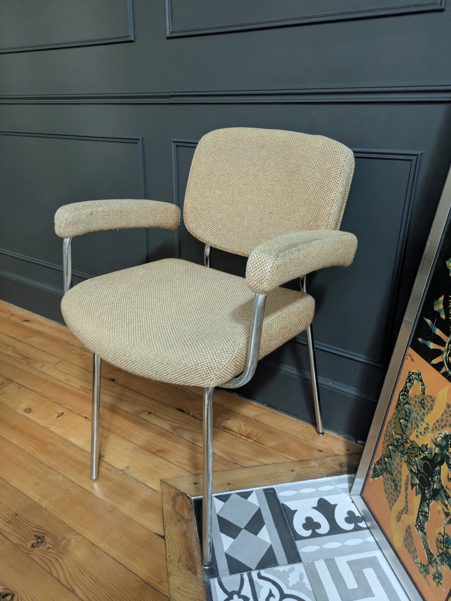 vintage tubular metal chrome office chair with patterned fabric.