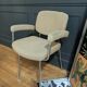 vintage tubular metal chrome office chair with patterned fabric.