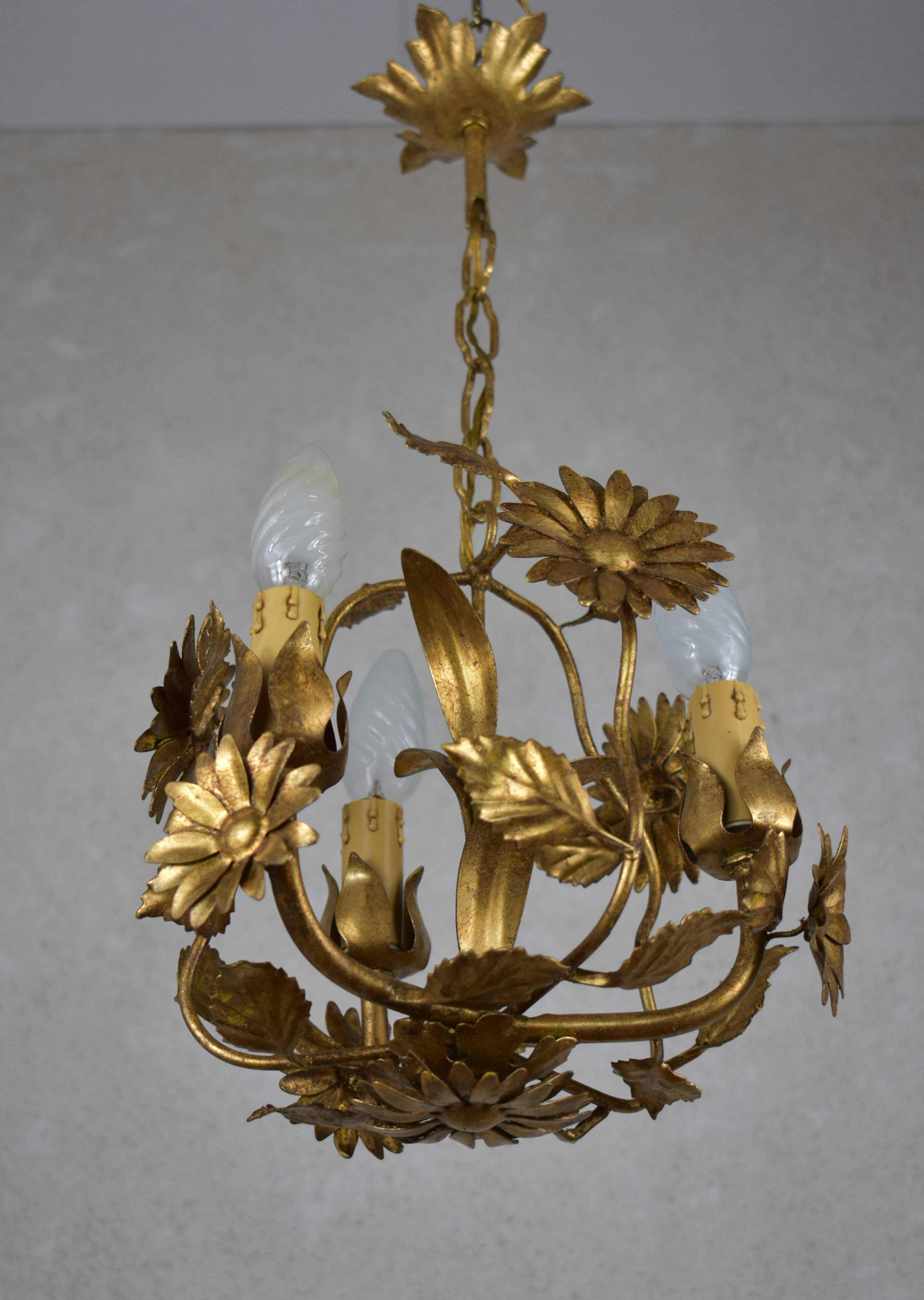 golden chandeliers with flowers.