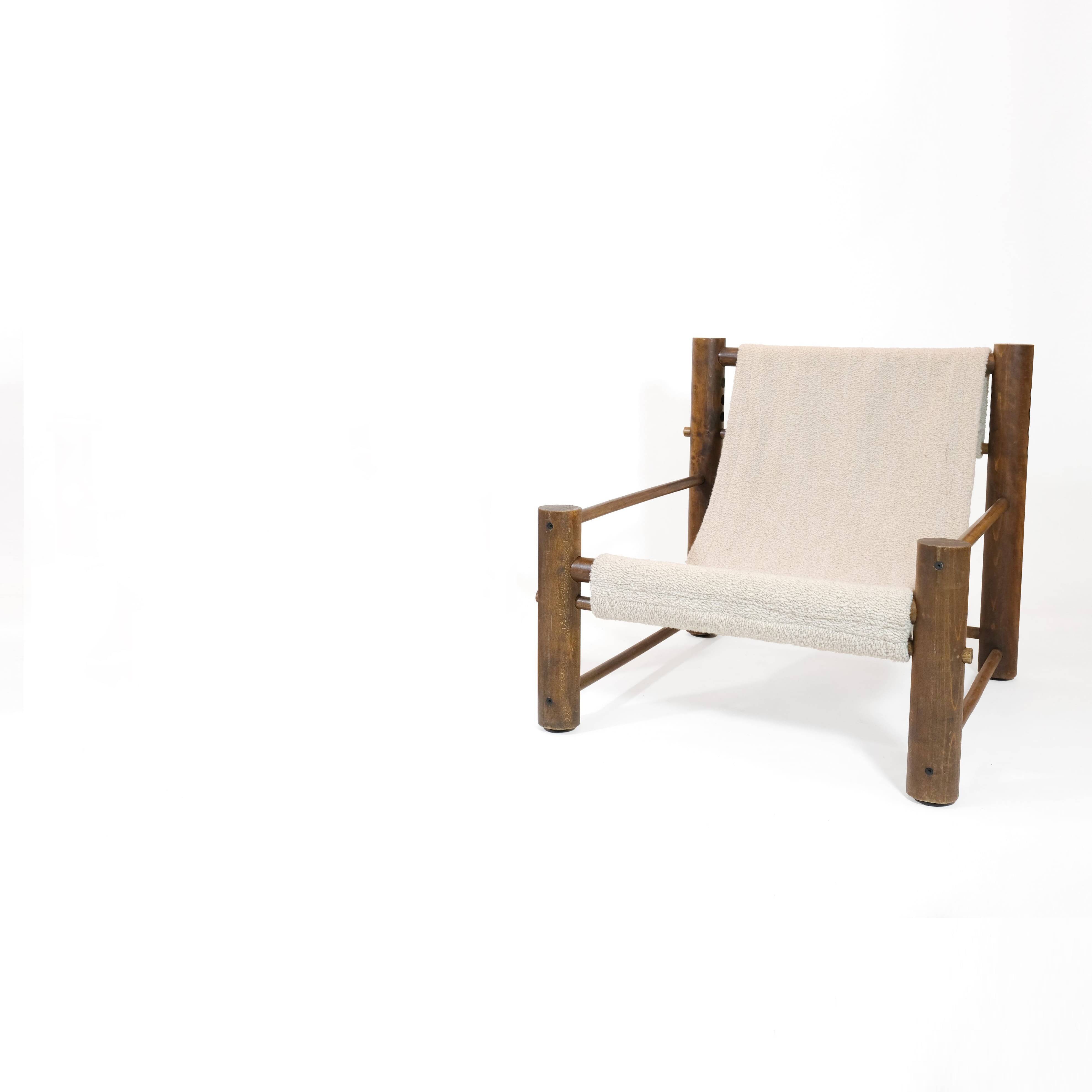 Solid wood armchair with adjustable backrest.