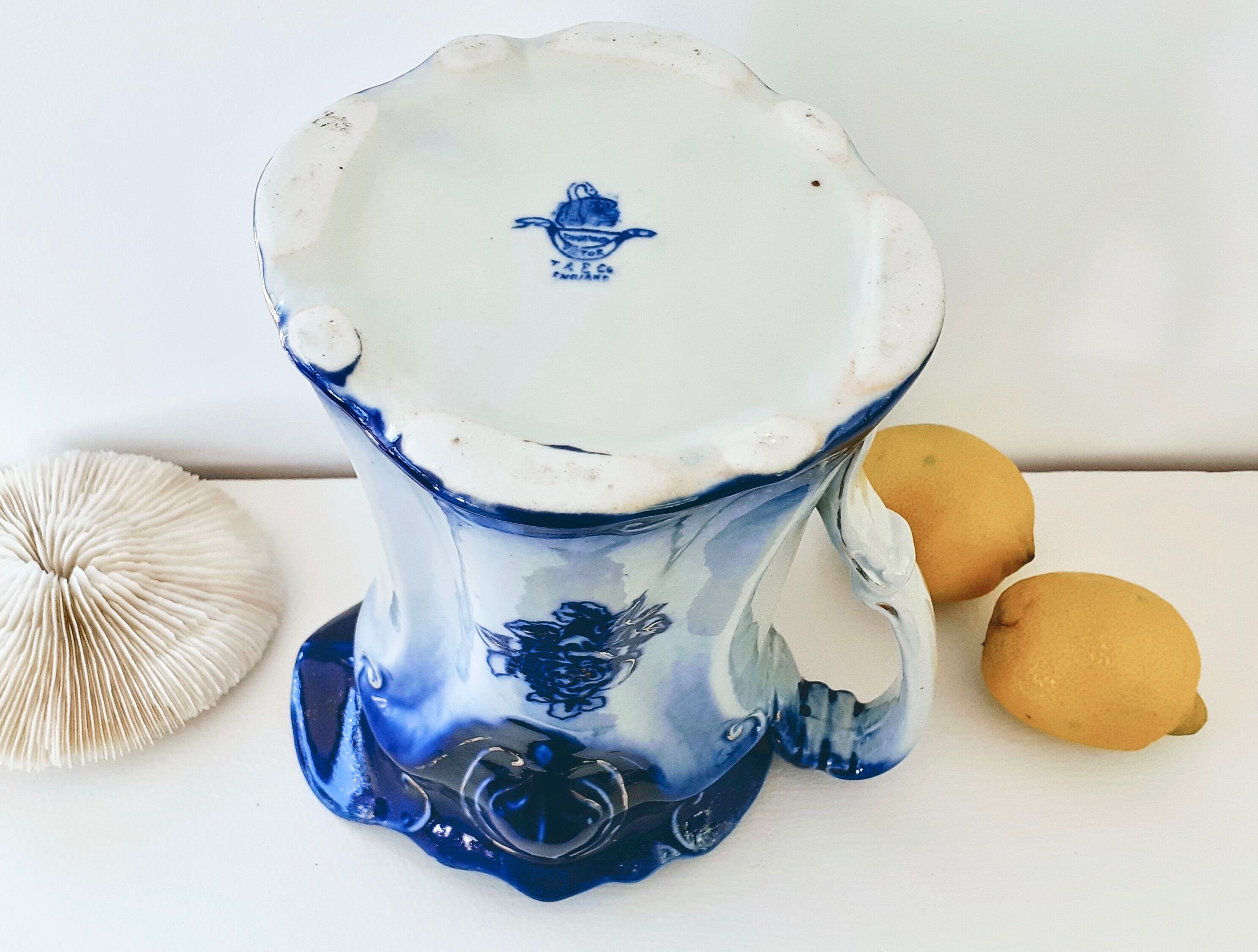 Old pitcher in blue flow, T.Rathbone, England circa 1910