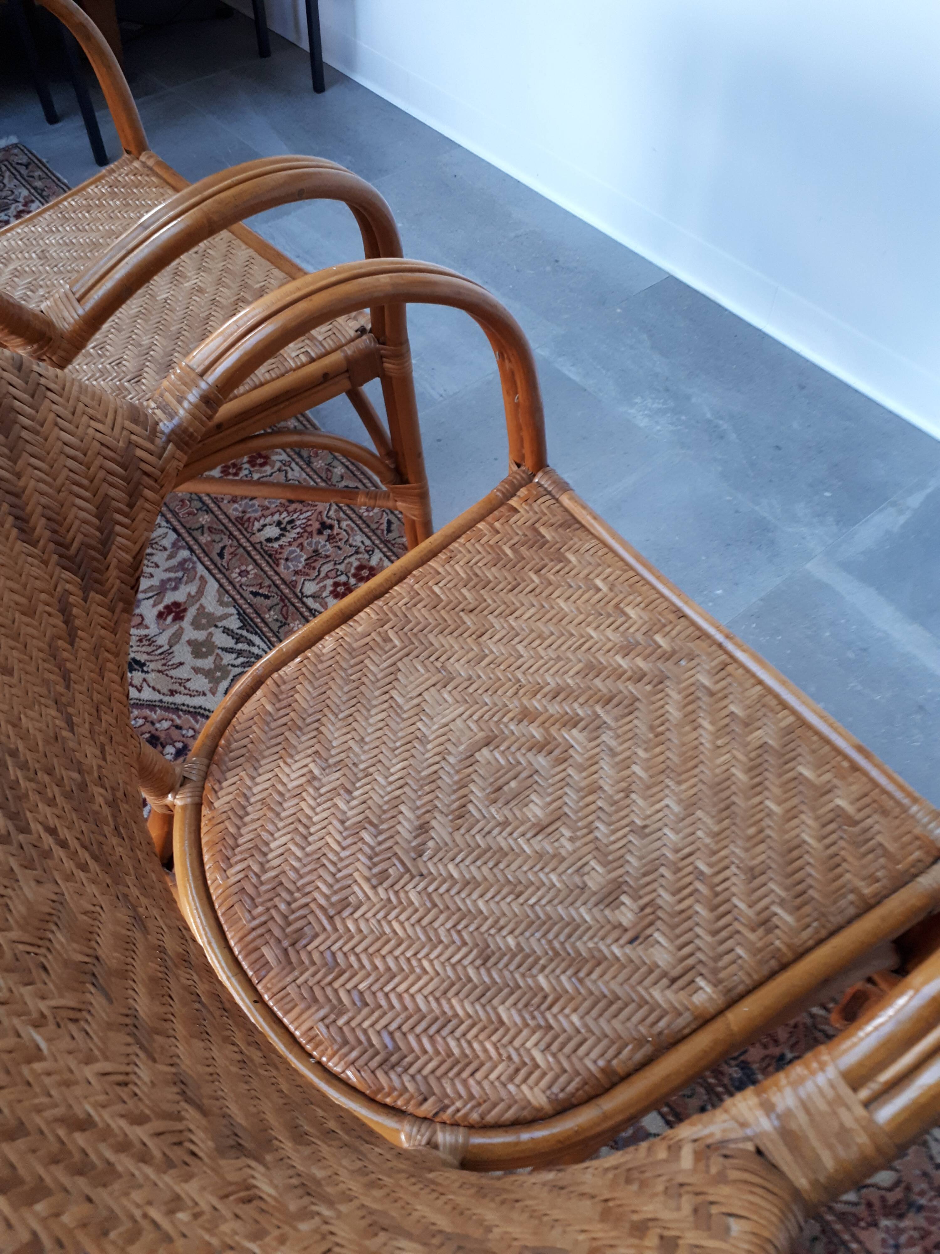 Pair of armchairs in braided rattan 70s