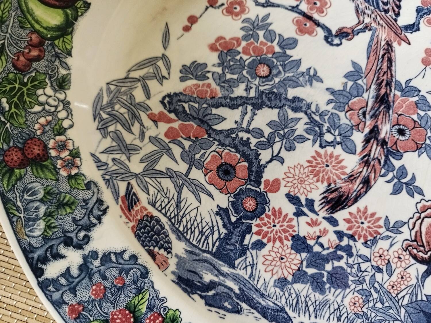 Oval Japanese plate with peacock decoration.