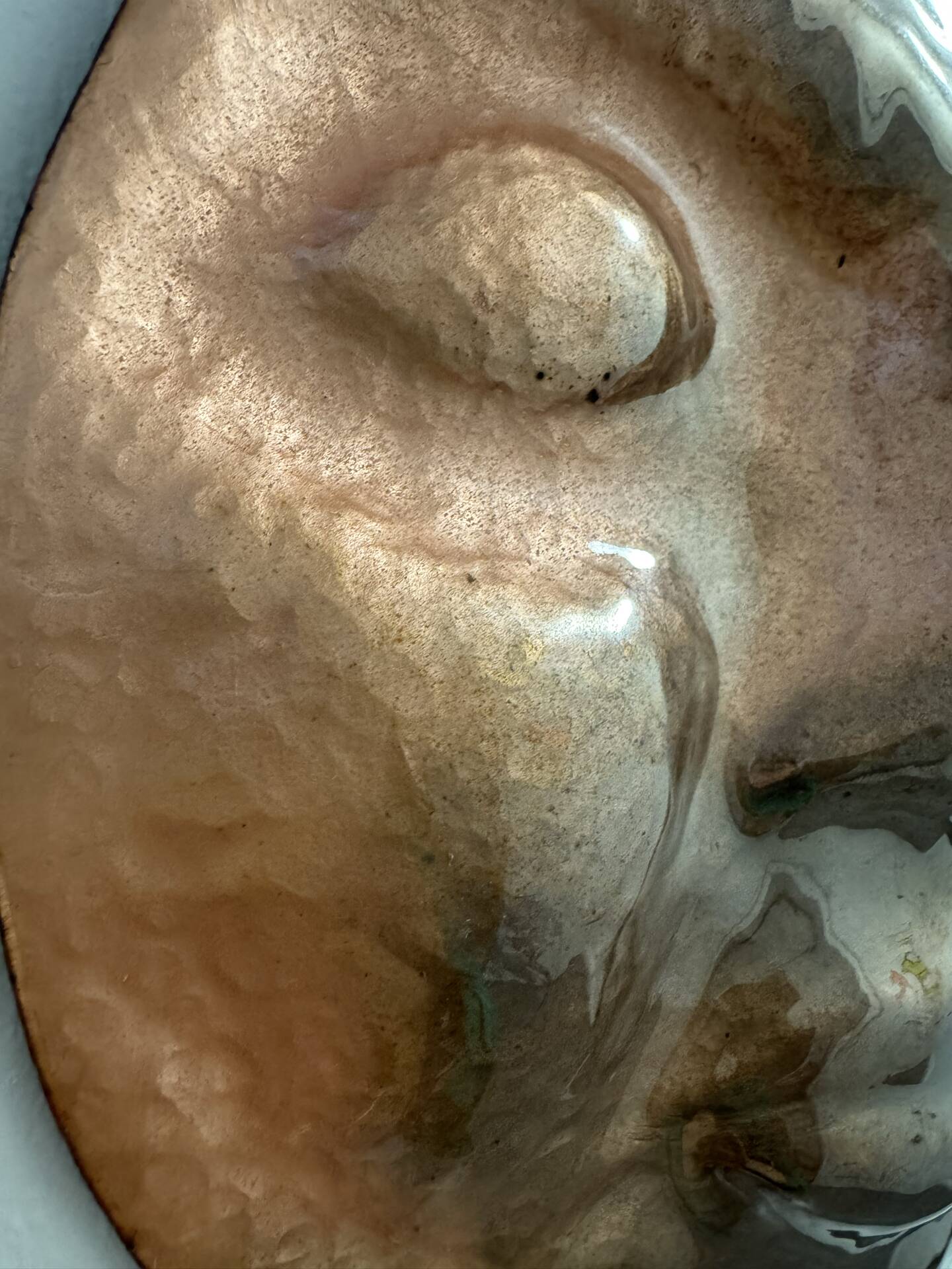 Sculpture face in embossed enamelled brass from the 1960s.