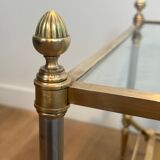 Coffee table in brass, brushed steel, glass, and gilded eglomisé mirror from Maison Jansen.