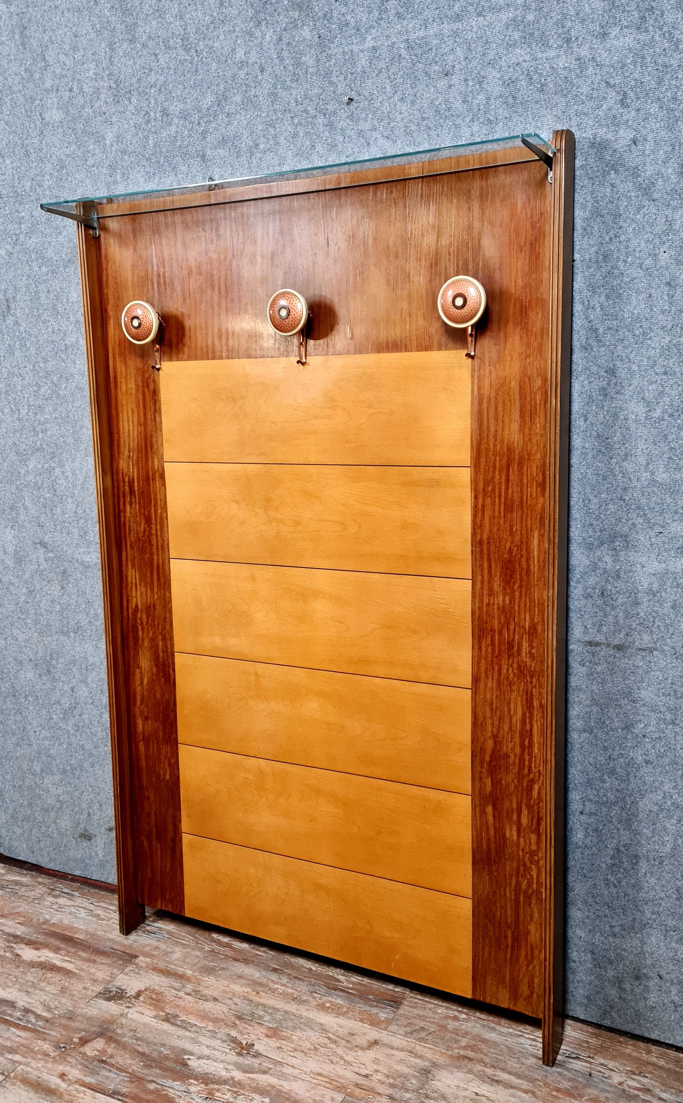 Art deco period coat rack in mahogany and light wood around 1940