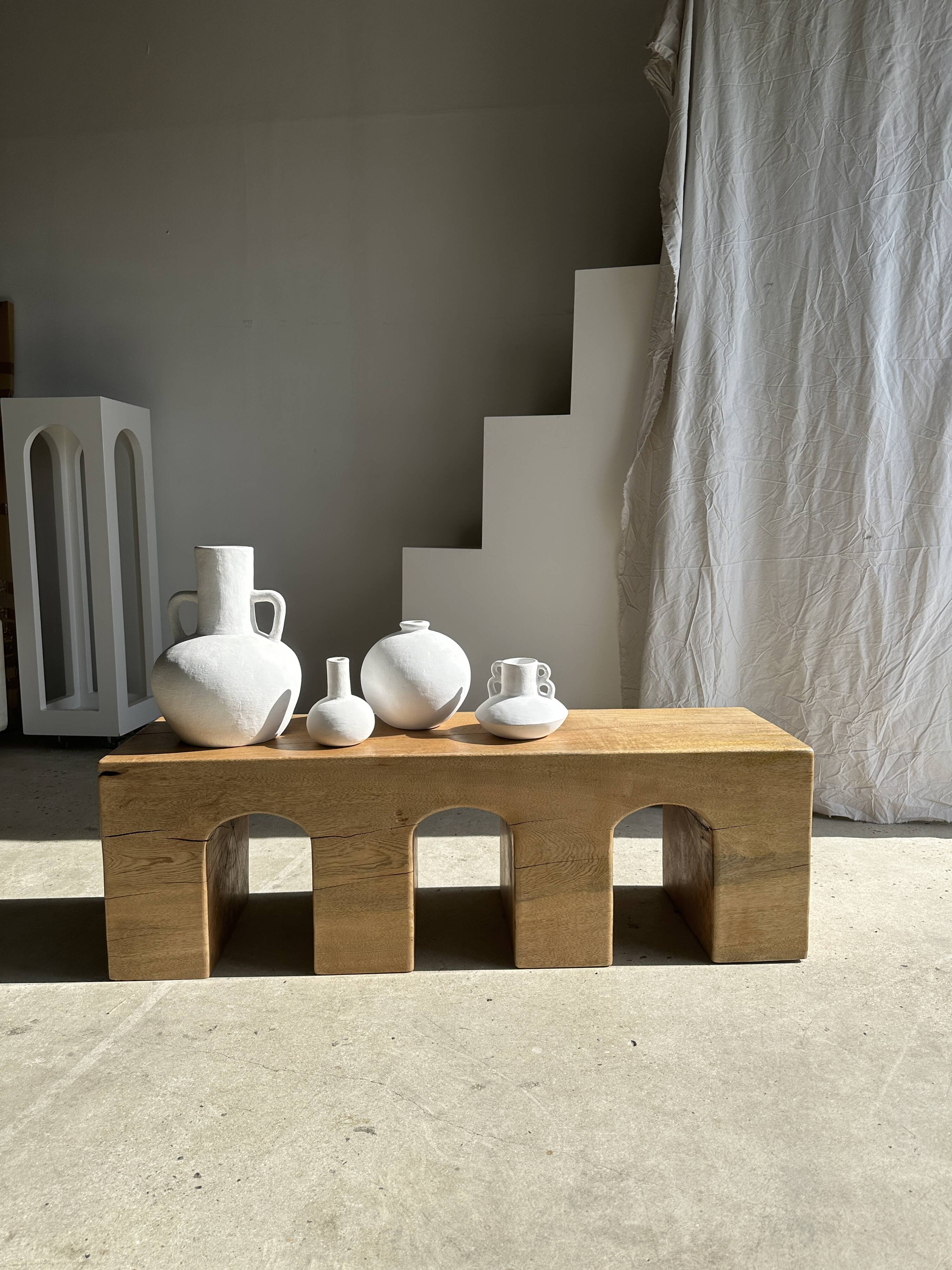 Solid monoxyl wood bench with carved 3-arch base - Natural wood color