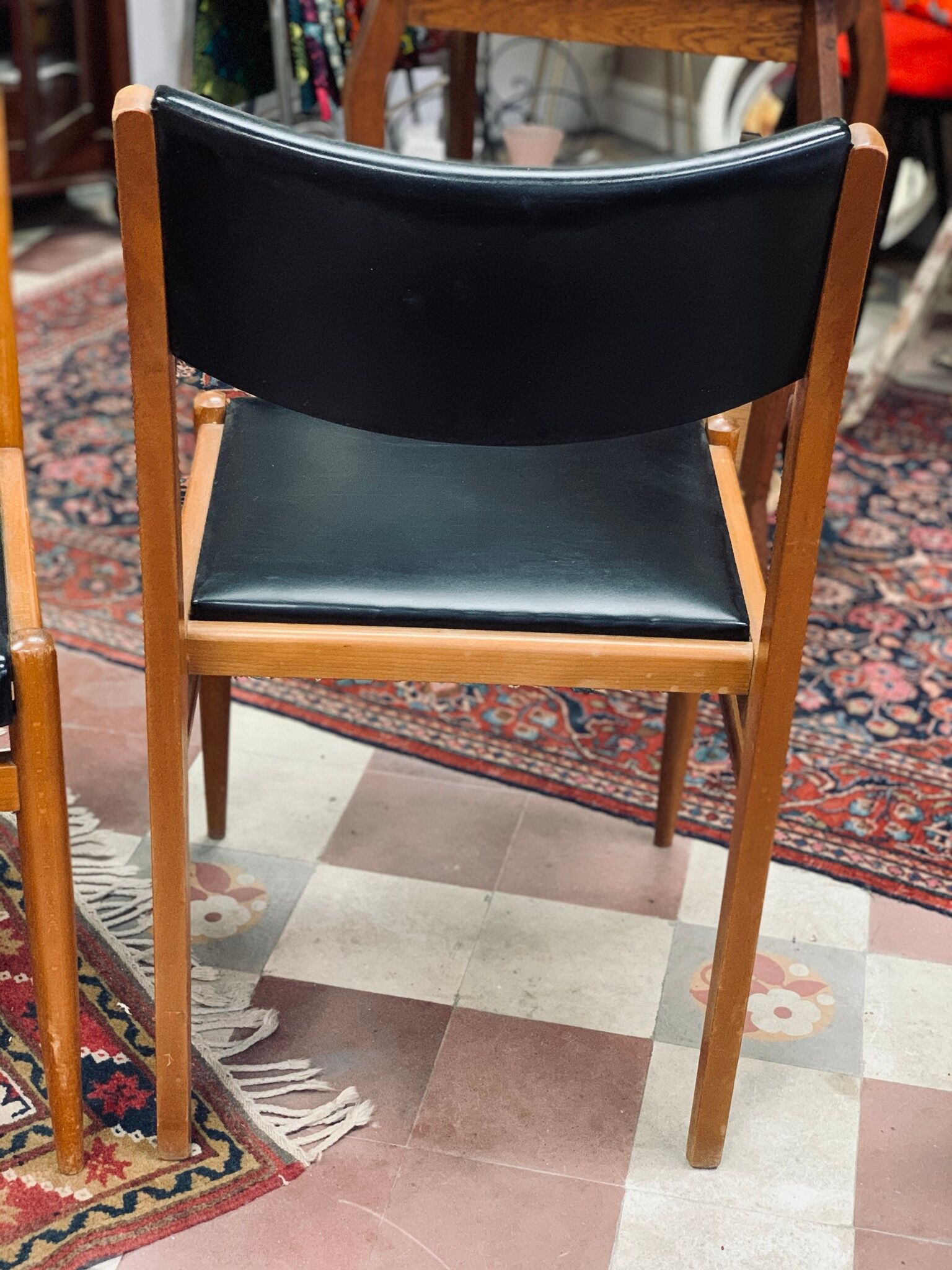 2 Scandinavian-style natural wood chairs, black trim
