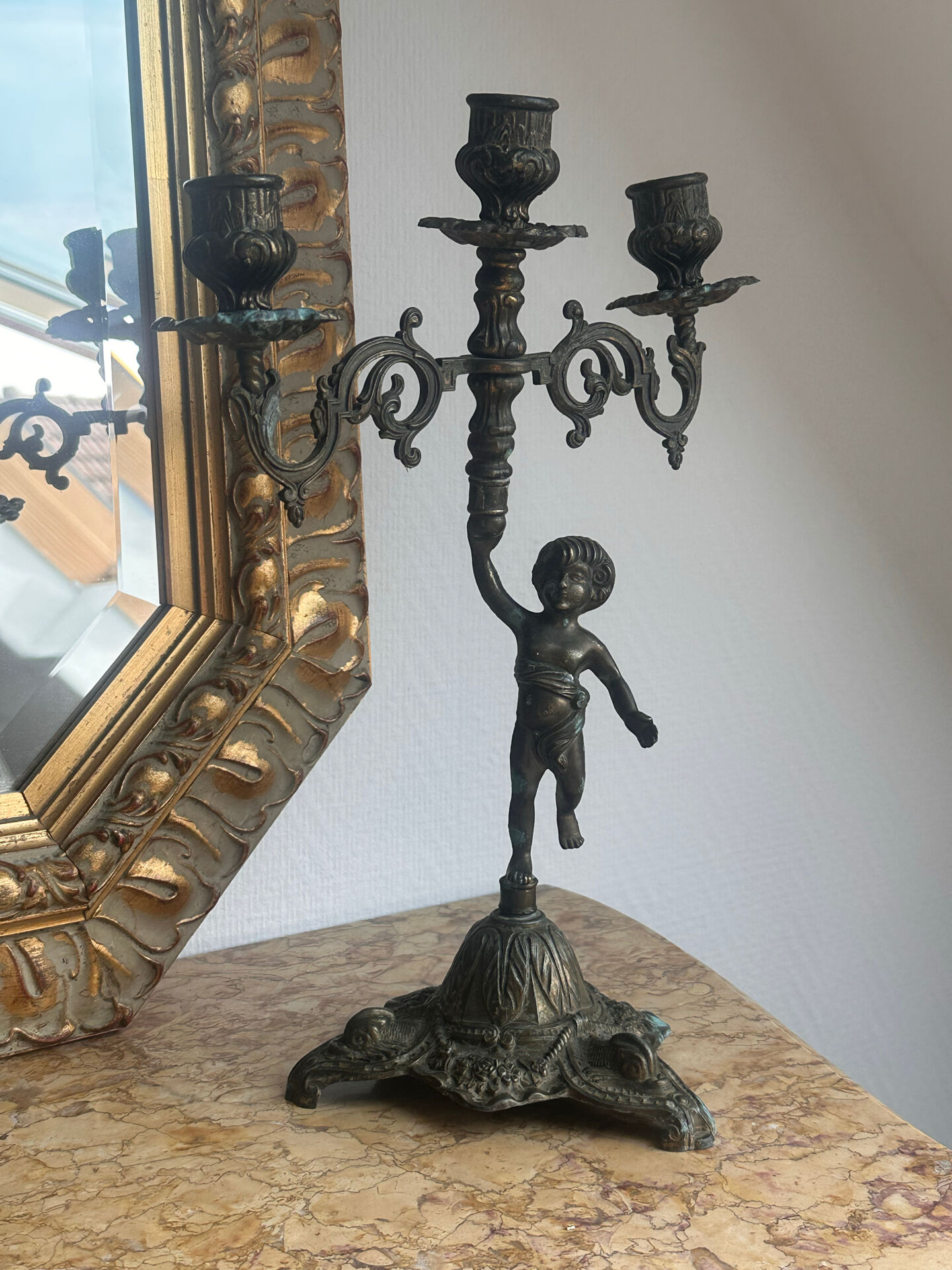 Set of 3 antique three-branch candelabras with cherubs and bronze patina.
