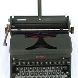 Hermes 2000 portable typewriter with its carrying suitcase