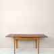 Scandinavian table with sliding panels.