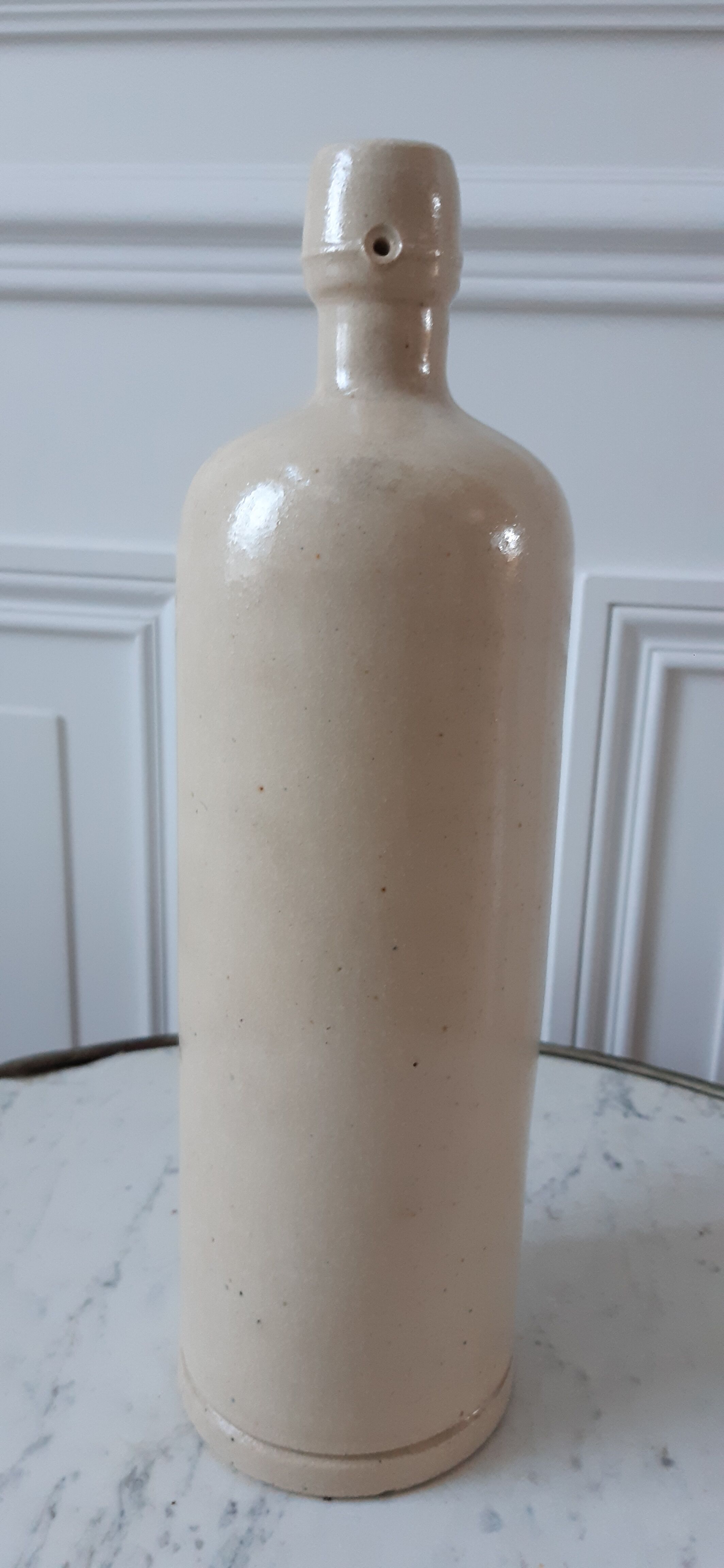 Bottle in ancient artisanal sandstone