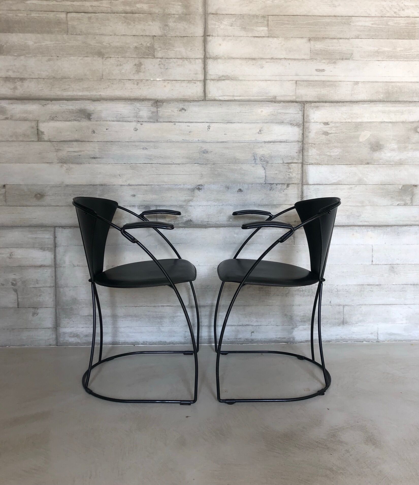 “Armlinda” black leather dining chairs by Arrben Italy