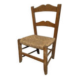 Vintage wooden and straw children's chair in a country style.