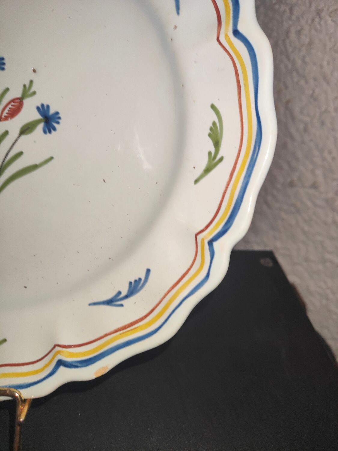 Old plate in earthenware of Nevers eighteenth Century with chantourné edges