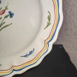 Old plate in earthenware of Nevers eighteenth Century with chantourné edges